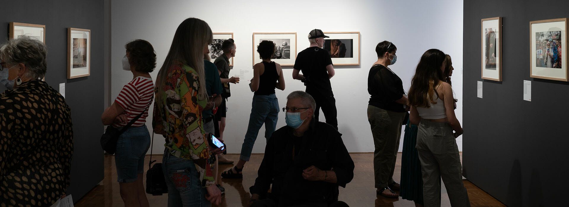 A group of people visiting the Delmar gallery.
