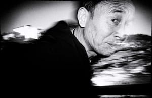 A black and white photo of a man.